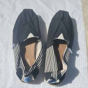 NWT TOMS Black Slip-On Shoes